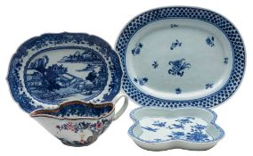 A mixed lot of three Chinese blue and white dishes and an underglaze blue and famille rose