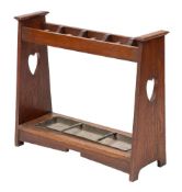 An Arts & Crafts oak stick stand in the manner of Liberty,