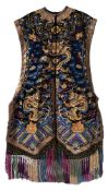 A Chinese silk and metal thread embroidered dragon jacket worked with dragons, phoenix, bats,