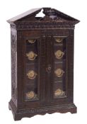 A Victorian carved oak table top cigar and cigarette cabinet, for Army & Navy CSL,