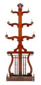 A Victorian mahogany hall stand, last quarter 19th century; with stylised anthemion finial,