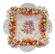 A Plaue porcelain dish, of pierced quadrilobed form on four scroll feet,