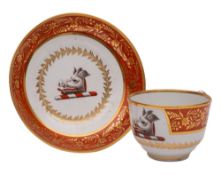 A Flight & Barr Worcester armorial teacup and saucer painted with a boar's head,