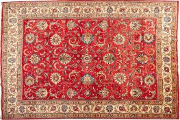A signed Meshed Carpet, the brick red field with an all over design of palmettes,