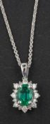 An 18ct gold, cushion-shaped, mixed-cut emerald and diamond cluster pendant, emerald weight 0.