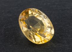 !An oval, mixed-cut yellow sapphire, weight ca. 5.45cts, dimensions ca. 11.3x9x6.3mms.