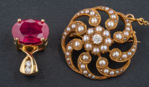 Two gemset pendants, including an 18ct gold, ruby and round,