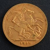 A George V sovereign coin, dated 1911, diameter ca. 21.9mms, total weight ca. 7.9gms.