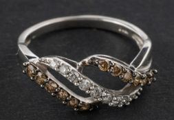 A three-row diamond cross-over ring, total estimated diamond weight ca. 0.