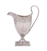 A George III silver helmet-shaped cream jug, makers probably Peter and Ann Bateman (marks obscured),