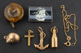 A box-link bracelet and charms, the bracelet stamped '375', the charms including inter alia,