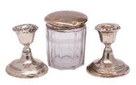 A silver topped glass drum-shaped toilet jar,