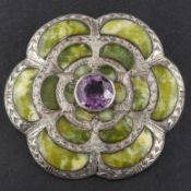 A mid-twentieth century, silver, Connemara marble and round, mixed-cut amethyst brooch,