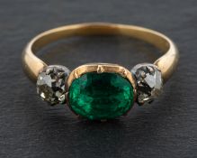 A 19th century, oval, mixed-cut, foiled back, emerald and cushion-cut diamond, three-stone ring,