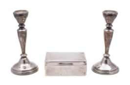 A pair of Elizabeth II silver candlesticks,
