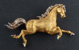 An 18ct gold, galloping horse brooch, set with single-cut diamonds,