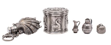 A Continental silver pill box of shaped outline, embossed with panels with peacocks,