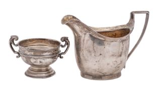 A George III silver milk jug, maker William Bennett, London 1801 of barge shape, gilt lining,