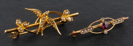 Two seed pearl, openwork, bar brooches, including an Edwardian, 9ct gold garnet brooch,