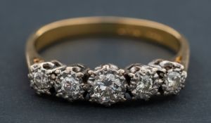 A round, brilliant-cut diamond, five-stone ring, total estimated diamond weight ca. 0.