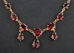 A 9ct gold, pear and oval, mixed-cut garnet necklace, weight of principal garnet ca.