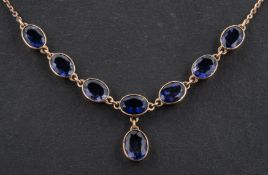A 9ct gold, oval, mixed-cut iolite necklace, with hallmarks for London, 1999, total length ca.