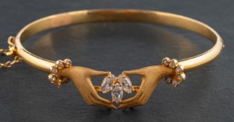 A 'Claddagh' hinged bangle, set with marquise-shaped CZ, stamped '18K', inner diameter ca. 5.