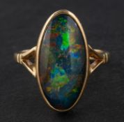 A 9ct gold, black opal triplet ring, with hallmarks for Birmingham, 1994, length of ring head ca. 2.