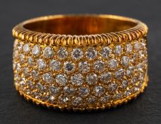 A round, brilliant-cut diamond, bombe ring, total estimated diamond weight ca. 1.
