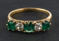 An emerald-cut emerald and old-cut diamond, five-stone ring, total estimated emerald weight ca. 1.