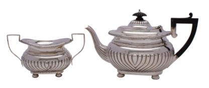 An Edward VII silver teapot and matching sugar basin, maker William M.