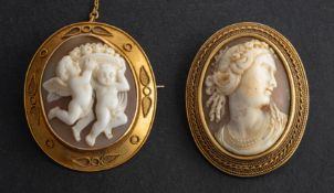 Two shell cameo brooches, with ropework surround,