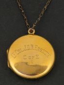 An early 20th century, circular locket pendant, stamped '9CT BACK & FRONT',
