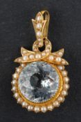 A round, mixed-cut light blue topaz and seed pearl pendant, estimated topaz weight ca.