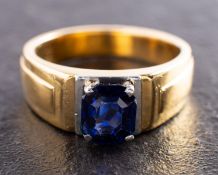 An octagonal, step-cut synthetic sapphire, single-stone ring, length of ring head ca. 0.