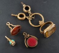 A collection of four seals, including a carnelian and bloodstone swivel fob,