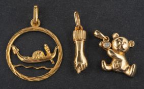 Three pendants, including a 9ct gold, round,