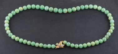 A graduated, single-row, jade bead necklace, diameter of beads ca. 7.2-9.