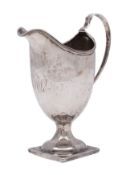 A Georgian unhallmarked silver helmet-shaped pedestal cream jug with reeded edge,