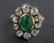 A 19th century, cabochon-cut emerald and old-cut diamond cluster ring, estimated emerald weight ca.