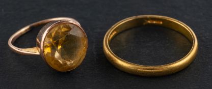 Two rings, including a round, mixed-cut citrine ring, estimated citrine weight ca. 4.