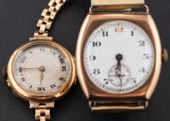 A gold wristwatch the dial with black Roman numerals, subsidiary seconds dial and moon hands,