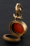 A bloodstone and carnelian locket seal fob, with hawk surmount, total length ca. 3.