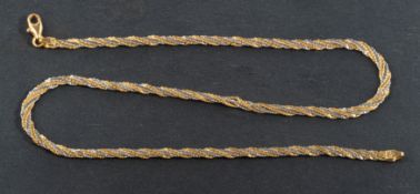 A three-row, Boston-link, bi-colour twist necklace, with Italian control marks for 18ct gold,