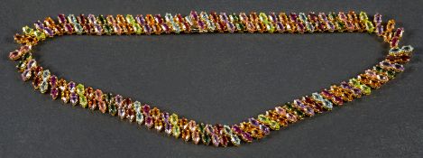 A vari-coloured gemset collar necklace, including inter alia, marquise-shaped garnet, amethyst,