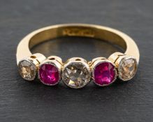 An old-cut and ruby five-stone ring, total estimated diamond weight ca. 0.