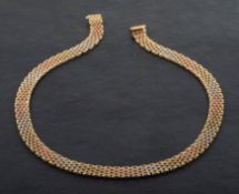 An Italian, 9ct tricolour gold, panther-link necklace, with import marks for Birmingham, 1993,
