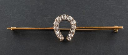 An old-cut diamond horseshoe brooch, total estimated diamond weight ca. 0.60ct, total length ca. 6.