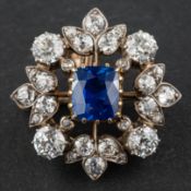 A cushion-cut, probably composite sapphire, old and single-cut diamond cluster pendant/ brooch,