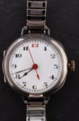 Rolex, a small silver wristwatch the round white dial with black Arabic numerals and red 12 o'clock,